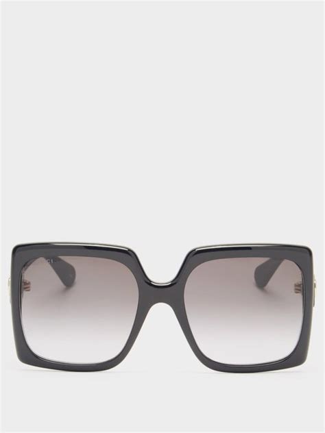 gucci gg logo oversized square acetate sunglasses in black modesens