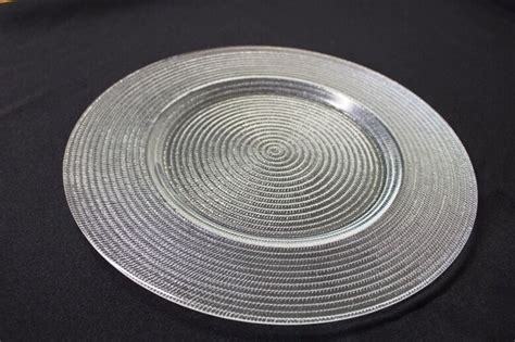 When hosting a dinner party the koyal wholesale'selection of glass charger plates provides a variety of choice from; 33cm Large Clear Glass Plates - Charger plates/dinner ...