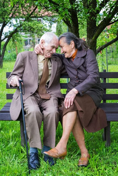 Cute 80 Plus Year Old Married Couple Posing For A Portrait In Their Garden Love Forever Concept