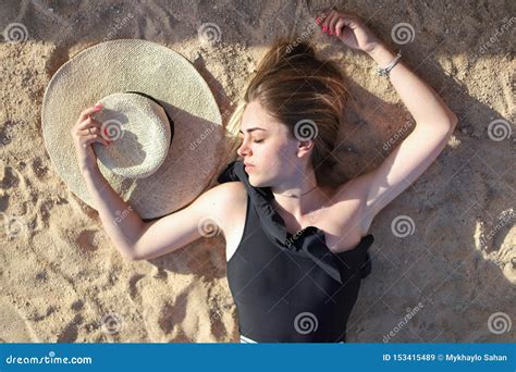 Portrait Of A Beautiful Tanned Girl On The Beach Woman Relaxing In Swimsuit On The Sand Stock