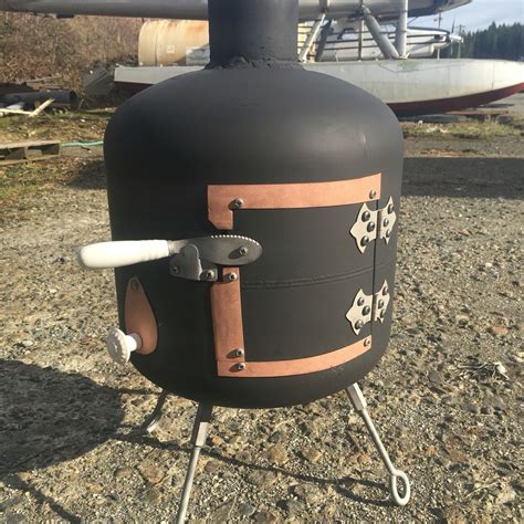 And moreover, fire pit tables are not a reliable way to warm up in cold weather. Propane tank wood stove #diy #woodstove | Rocket stoves ...