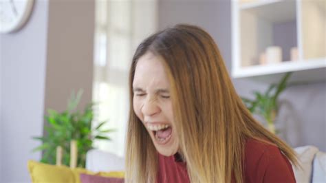 Woman Screaming At Home Draining Your Nerves A Woman Grits Her Teeth