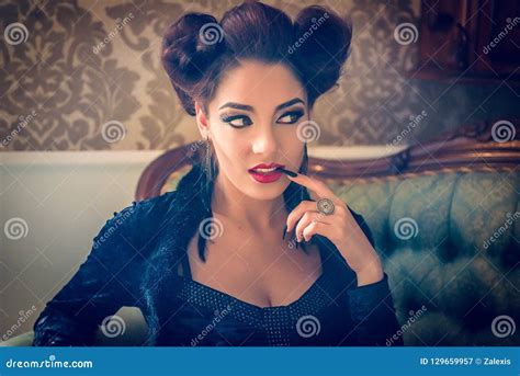 caucasian model looking like a vampire with a black stilett stock image image of indoors
