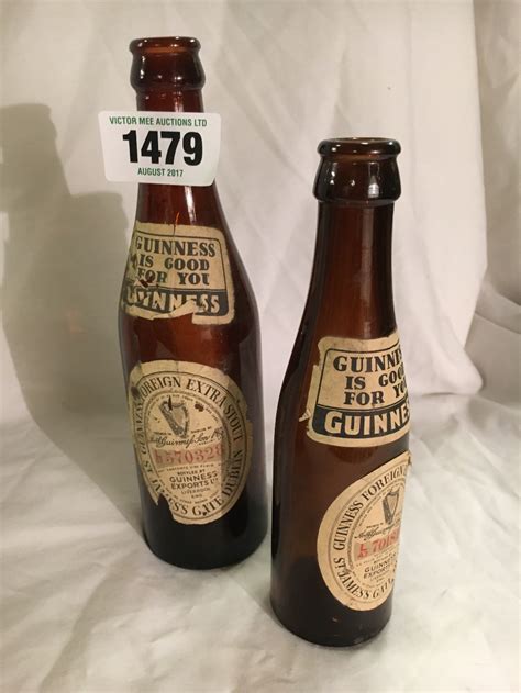 Two Early Machine Made Guinness Bottles With Original Labels