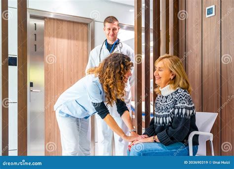 Nurse Comforting A Patient In The Waiting Room Stock Image Image Of