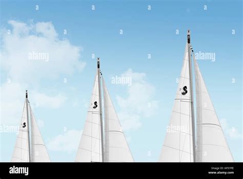 White Sails On Sailboats With A Dreamy Blue Sky And Clouds Stock Photo