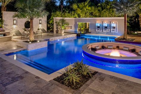 Tropical Pool With Sunken Fire Pit Seating Area Hgtv Ultimate Outdoor