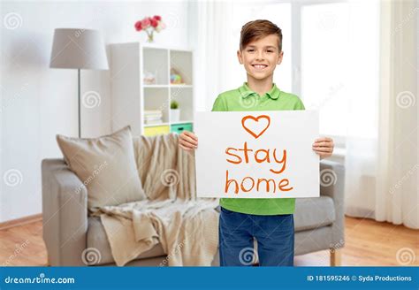 Happy Boy Holding Stay Home Message On Paper Stock Photo Image Of