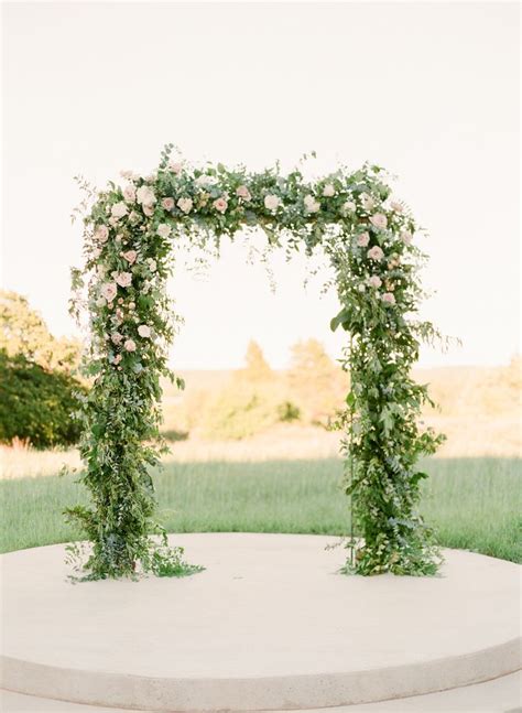 Wedding Ceremony Arborarch With Greenery And Simple Blush And Ivory