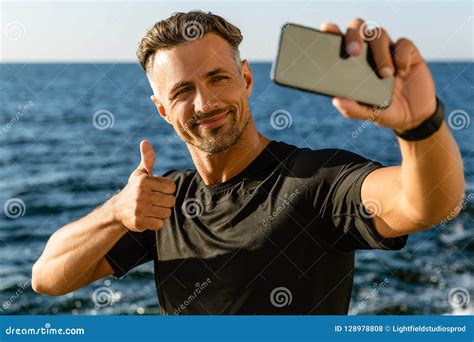 Happy Adult Man Taking Selfie With Smartphone And Showing Thumb Up Stock Photo Image Of
