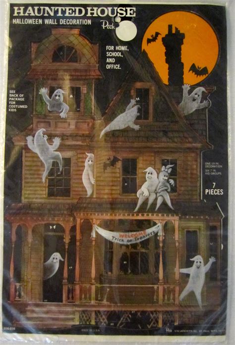 An Old House Decorated For Halloween With Spooky Ghost Decorations