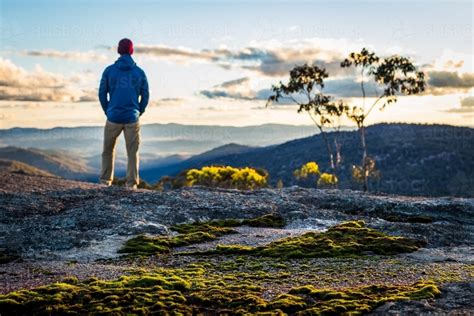 Image Of Figure Overlooking Mountain View Austockphoto