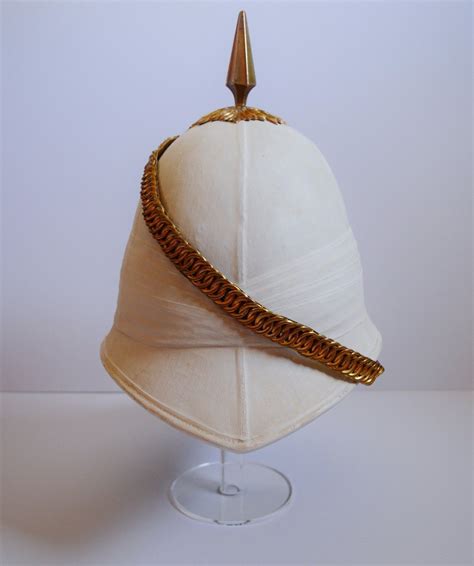 The helmet has been treated with several coats of 'blanco' (whitening mixture) and then naturally aged to give a lovely yellow/tan patina. British Foreign Service Helmet, Pith Helmet, Tropical ...