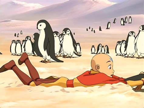 Aang Grabbing The Tail Of An Otter Penguin And Being Dragged By It