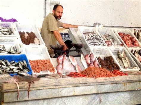 Fishmonger In A Local Market