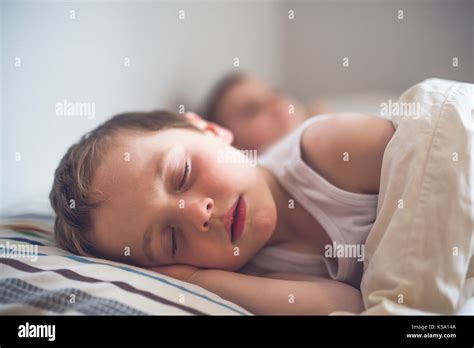 Young Boy Sleeping In Bed Stock Photo Alamy