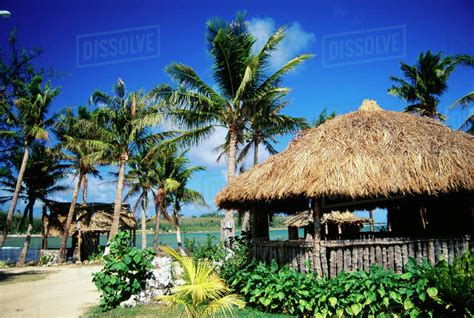 Guam Inajaran Cultural Village With Grass Huts Along Beach Greenery