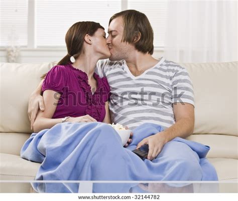 Adorable Couple Kissing On Coach Blue Stock Photo Shutterstock