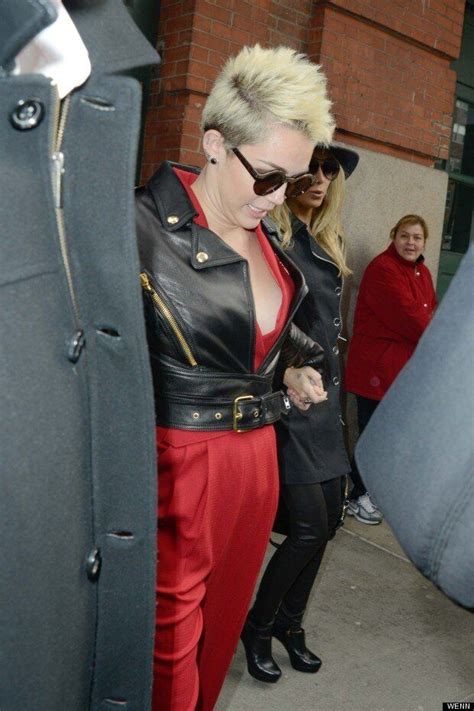 Miley Pops Out In Red Jumpsuit At Rachel Zoes New York Fashion Week