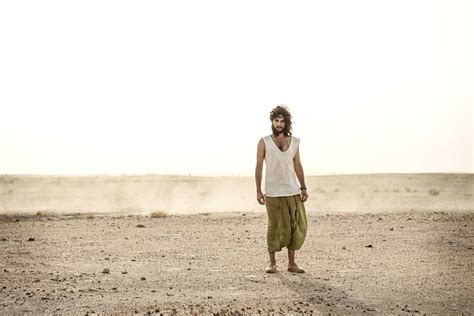 Man Standing In The Desert Alone Stock Photo