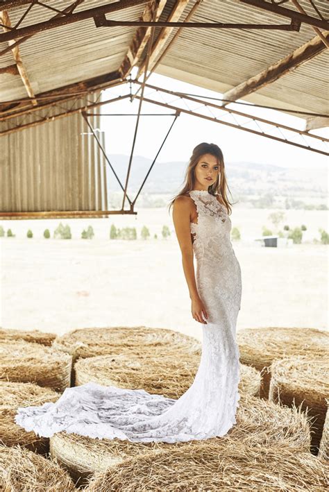 The exposed farmhouse tables lend a rough, rustic vibe while eucalyptus runners soften the aesthetic. Romantic Country Wedding Dresses