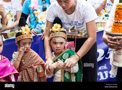 Lao little girls joining traditional Lao New Year parade in Luang Stock ...