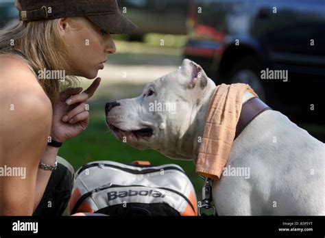 A Woman With Her Pit Bull Before Competitions During Pit Bull Show In