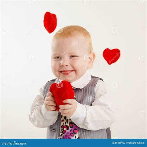 Baby Boy With A Soft Red Heart In Hands Royalty Free Stock Photography