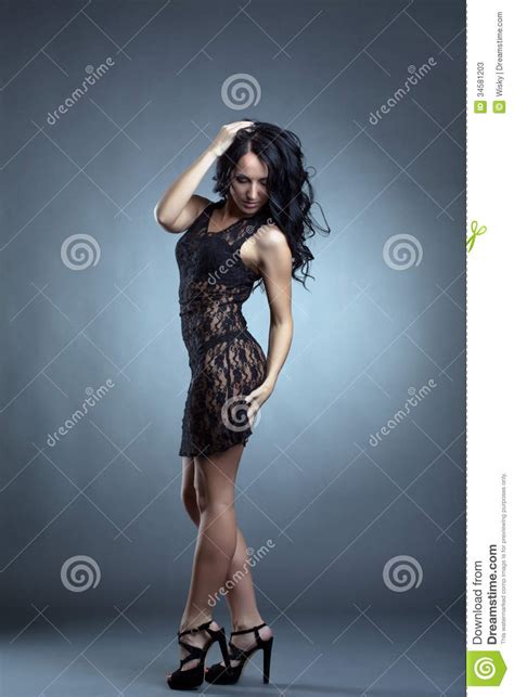 Hot Slender Brunette Posing In Black Lacy Negligee Stock