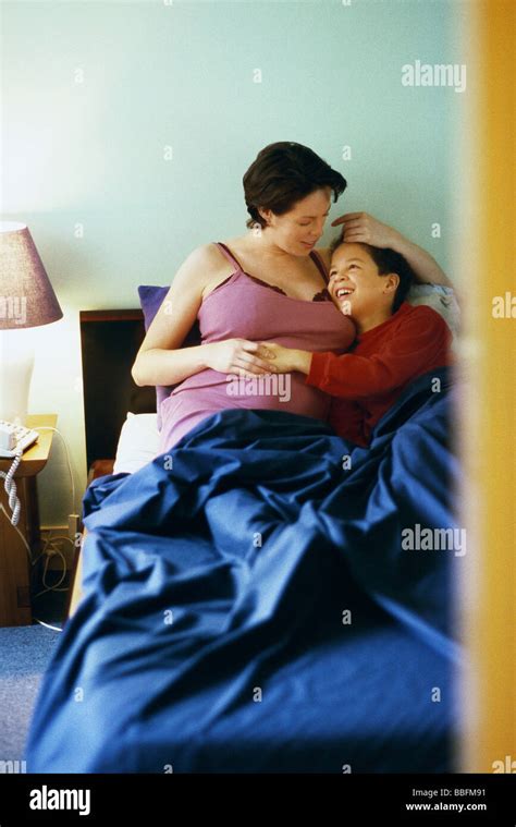 Mother And Son Talking In Bed Stock Photo Alamy