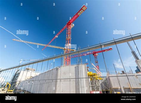 Large Construction Site With Construction Fence And Cranes Stock Photo