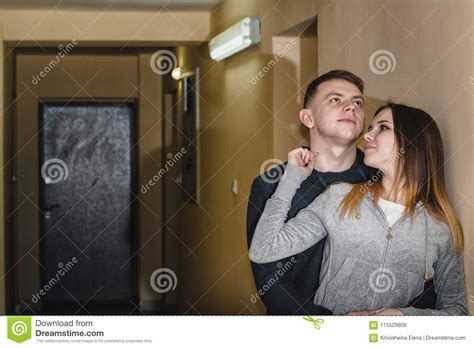 Teenagers Boyfriend And Girlfriend Hugging Each Other In The Corridor