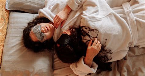Women Wearing Bathrobes Lying On Bed · Free Stock Photo