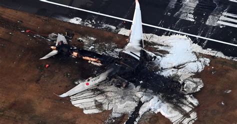 Japan Plane Incredible Footage Shows Burnt Out Wreck Of Plane On Runway After Fireball World