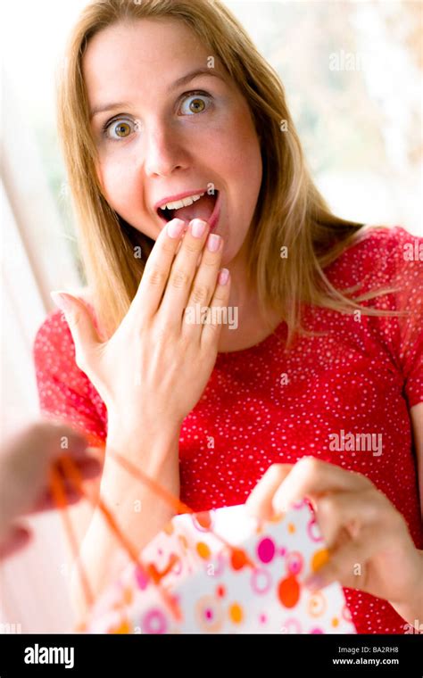 Woman Receiving Present Stock Photo Alamy