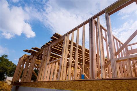 New Home Construction Framing Of A House Under Construction Stock Photo