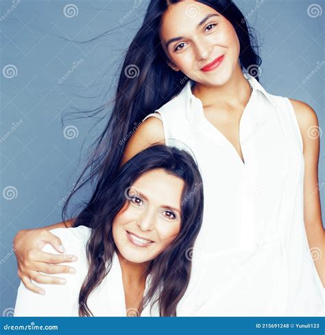 Cute Pretty Teen Daughter With Mature Mother Hugging Fashion Style Brunette Lifestyle People