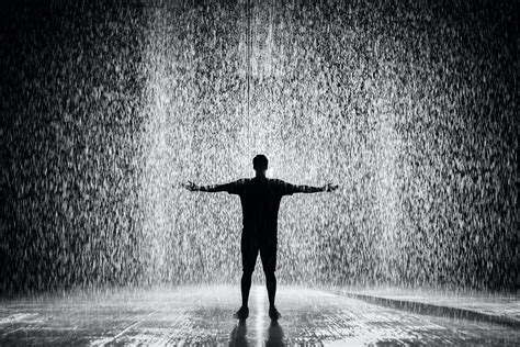 Silhouette And Grayscale Photography Of Man Standing Under The Rain