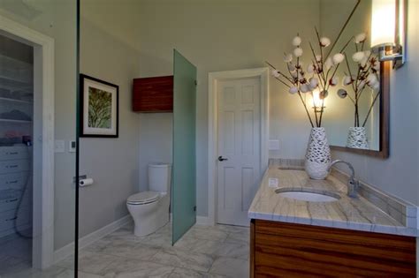 Carrera marble shower with 2 rain shower heads and body jets, freestanding tub, modern custom mirrored sliding door, carrera marble floor with mosaic inset, board and batten walls with mirror over vanity, 3 pendant lights at vanity and custom white and carrera double vanity #carrera #marble. Contemporary Master Bath with Walnut Vanity and Carrara ...