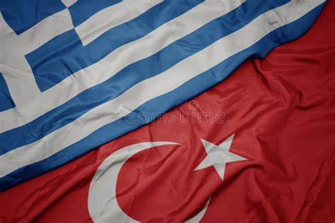 Waving Colorful Flag Of Turkey And National Flag Of Greece Stock Photo