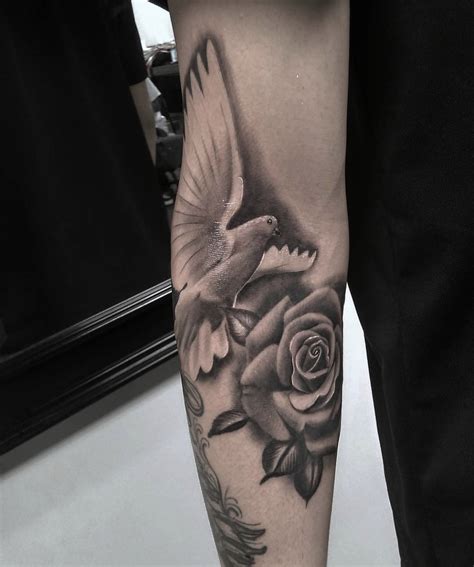 Roses are beautiful and lovely. black and white dove with rose tattoo on arm ...