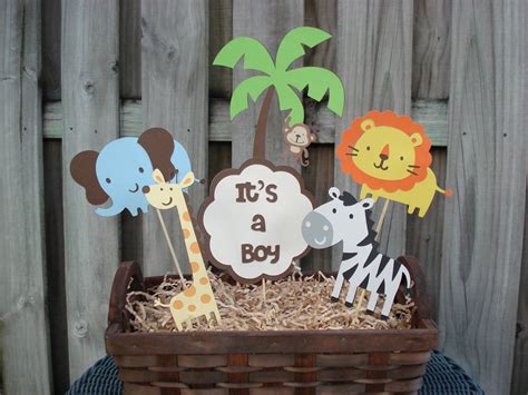 Use the brown and yellow shades of the lion and giraffe and have a natural, neutral these safari baby shower decorations are designed with blue and green colors to match your born to be wild baby shower theme. Pin on baby things