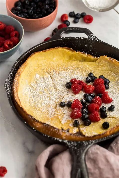 This Dutch Baby Pancake Is Baked In A Preheated Cast Iron Skillet Which