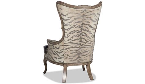Create an inviting atmosphere with new living room chairs. Leather and animal print armchair