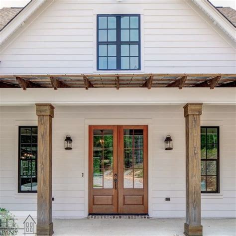 Farmhouse Porch With Rustic Wooden Corbels And Beams House Exterior