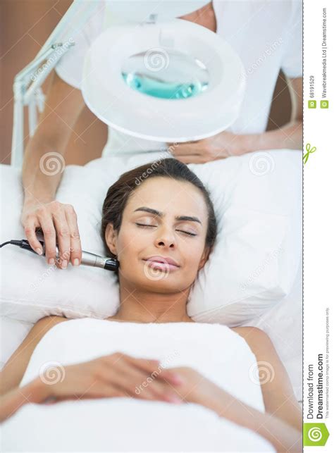 Woman With Eyes Closed While Receiving Facial Massage Stock Image Image Of Therapy Masseur