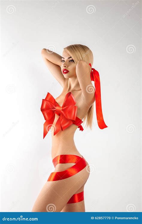 Sexy Blonde Woman Gift With Ribbons On Body Looking Away Stock Photo