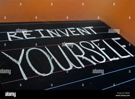 Reinvent Yourself Phrase Handwritten On Black Chalkboard Stock Photo