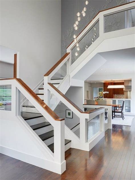 The Stairs In This House Are Made From Wood And Glass