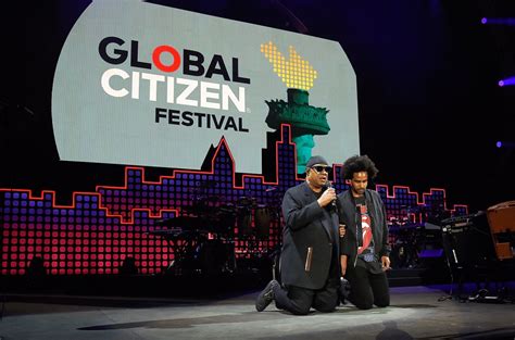 Stevie Wonder Kneels While Singing National Anthem At Formula 1 Race Billboard